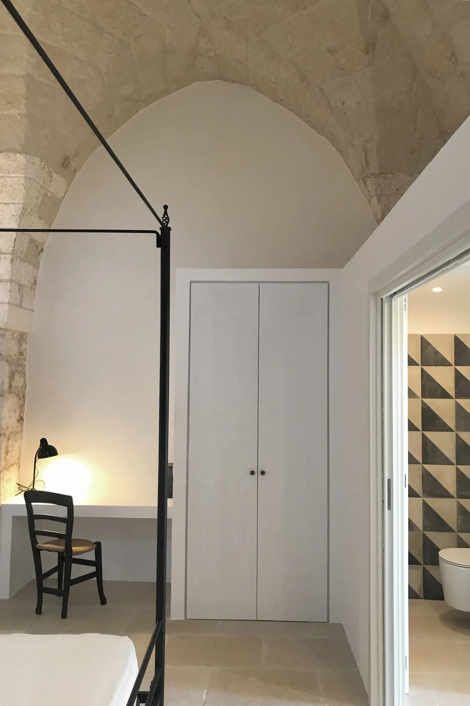 Bedroom with vaulted ceiling and writing desk