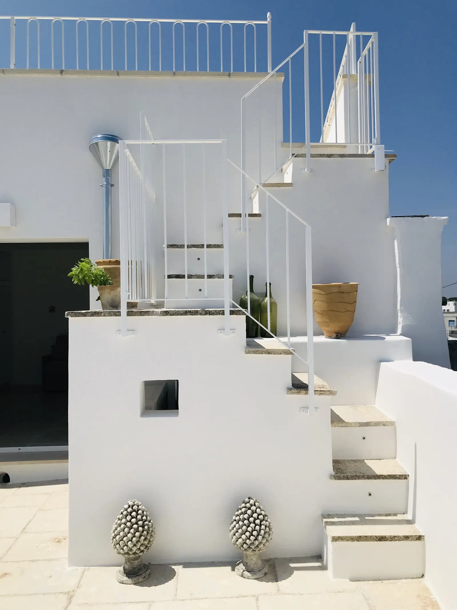 Whitewashed steps up to the upper terrace