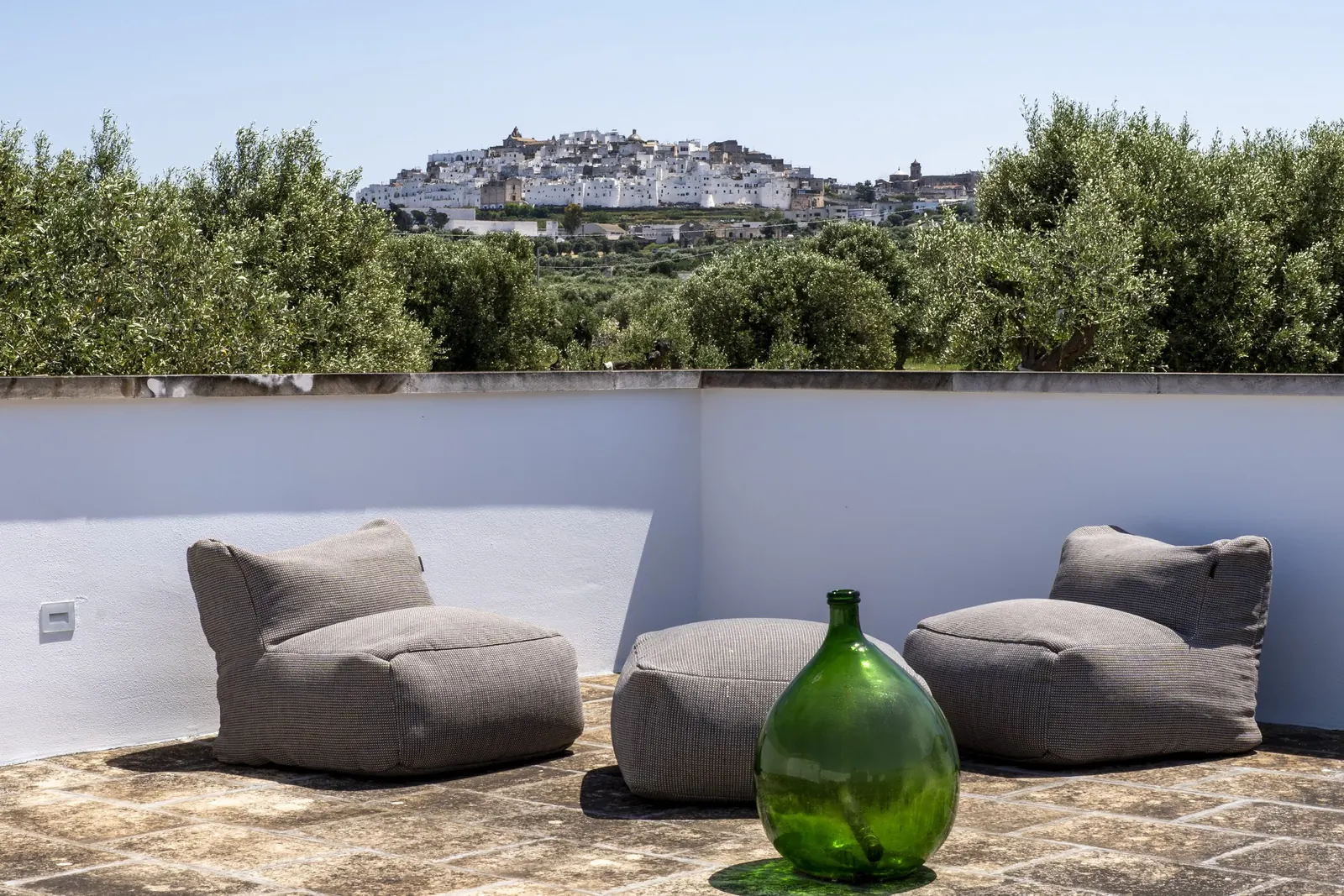 Bean-bag seating on the roof terrace with Ostuni on the horizon
