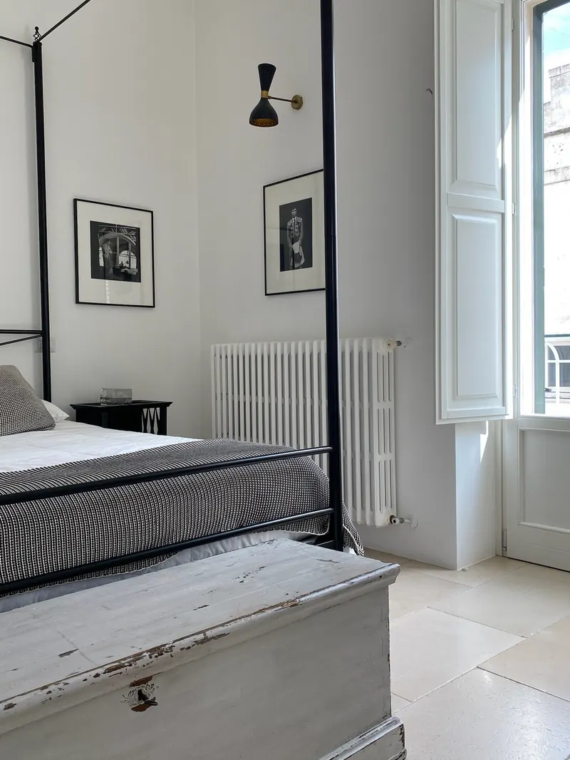 Four-poster bed beside the window