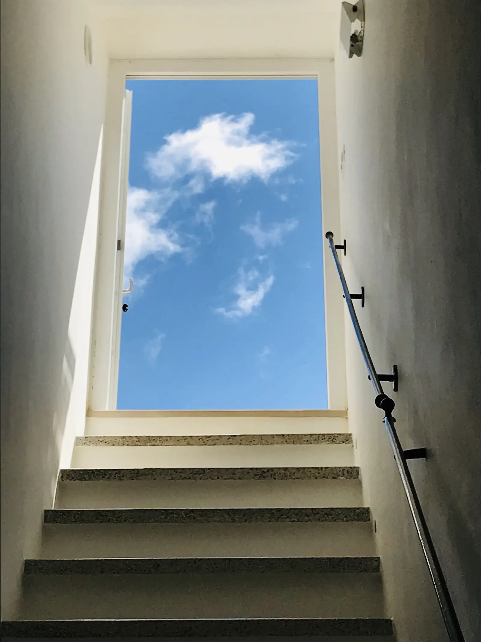 Stairs up to the rooftop terrace