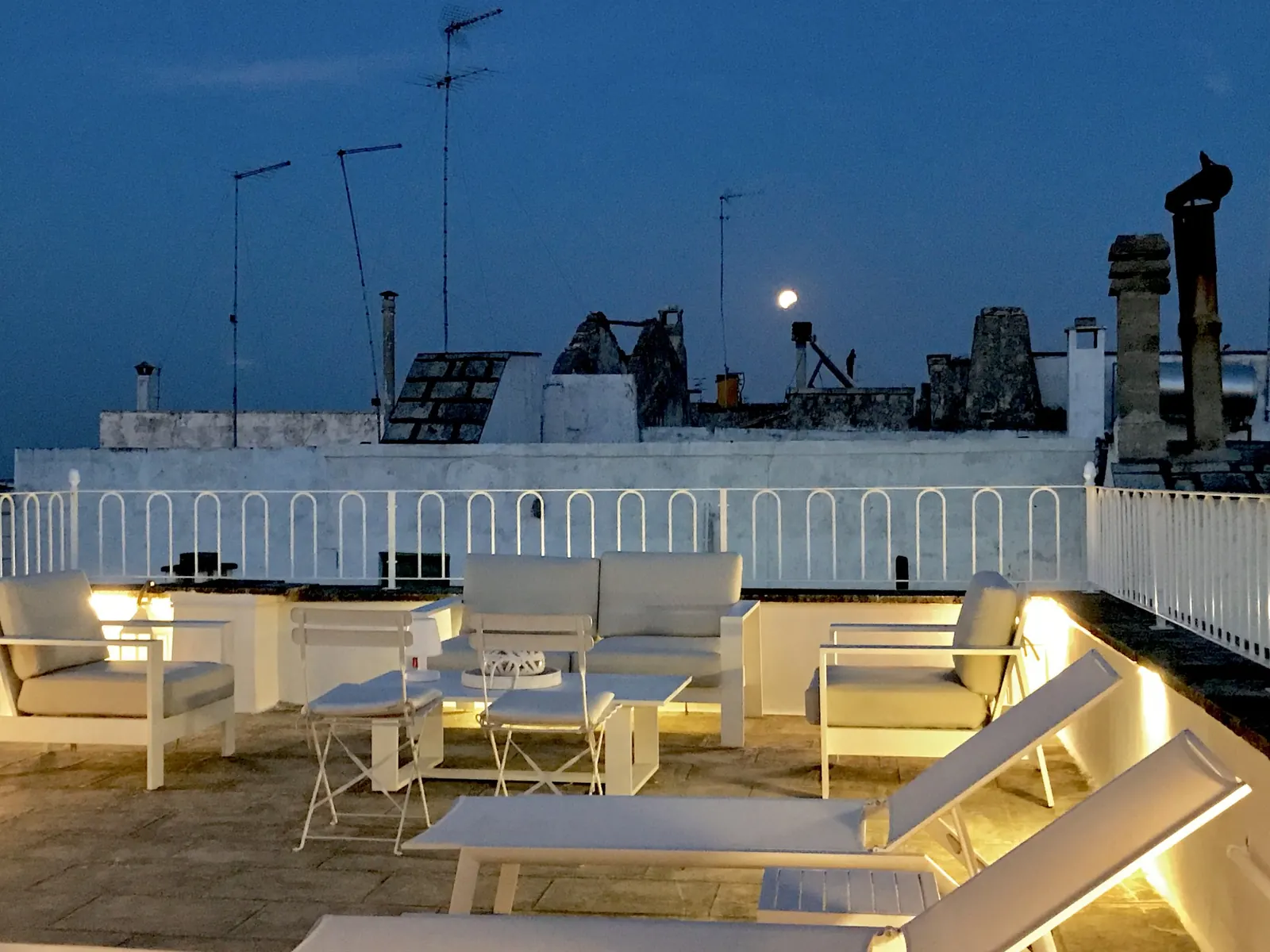 Rooftop terrace lit at night