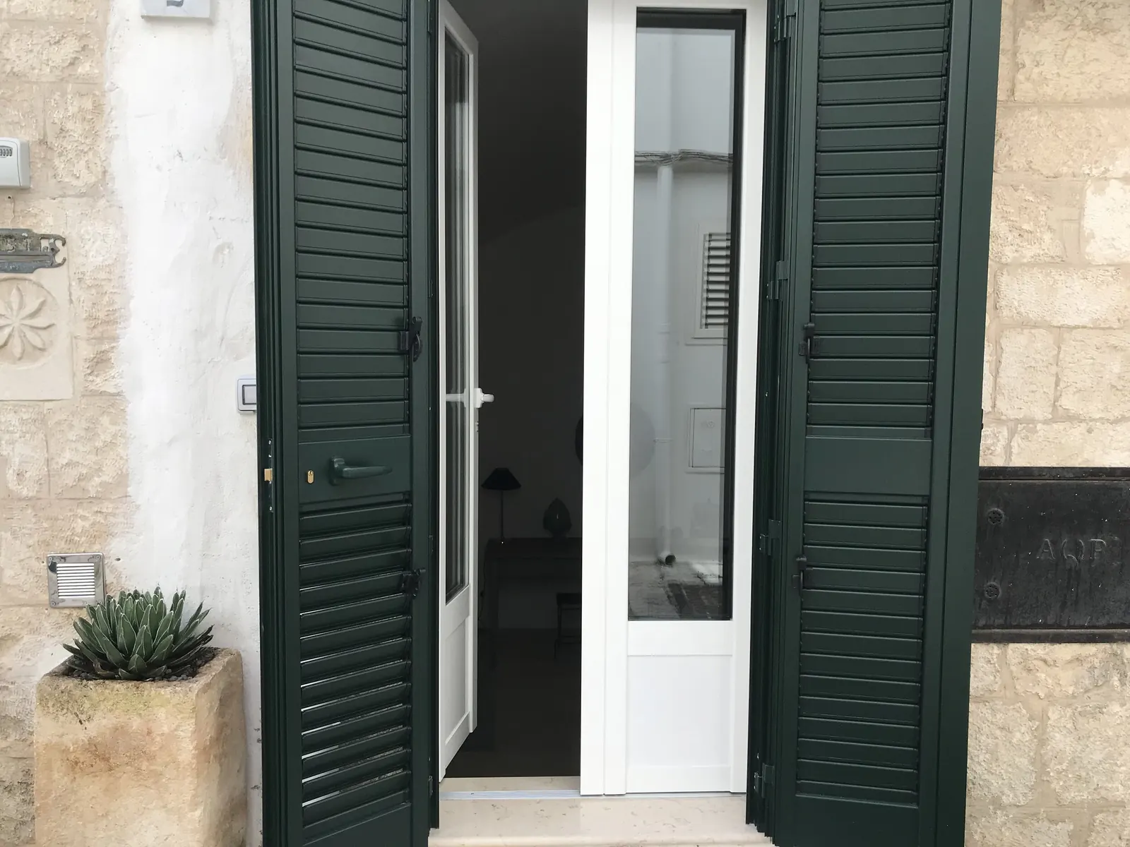 Green shutters at the entrance