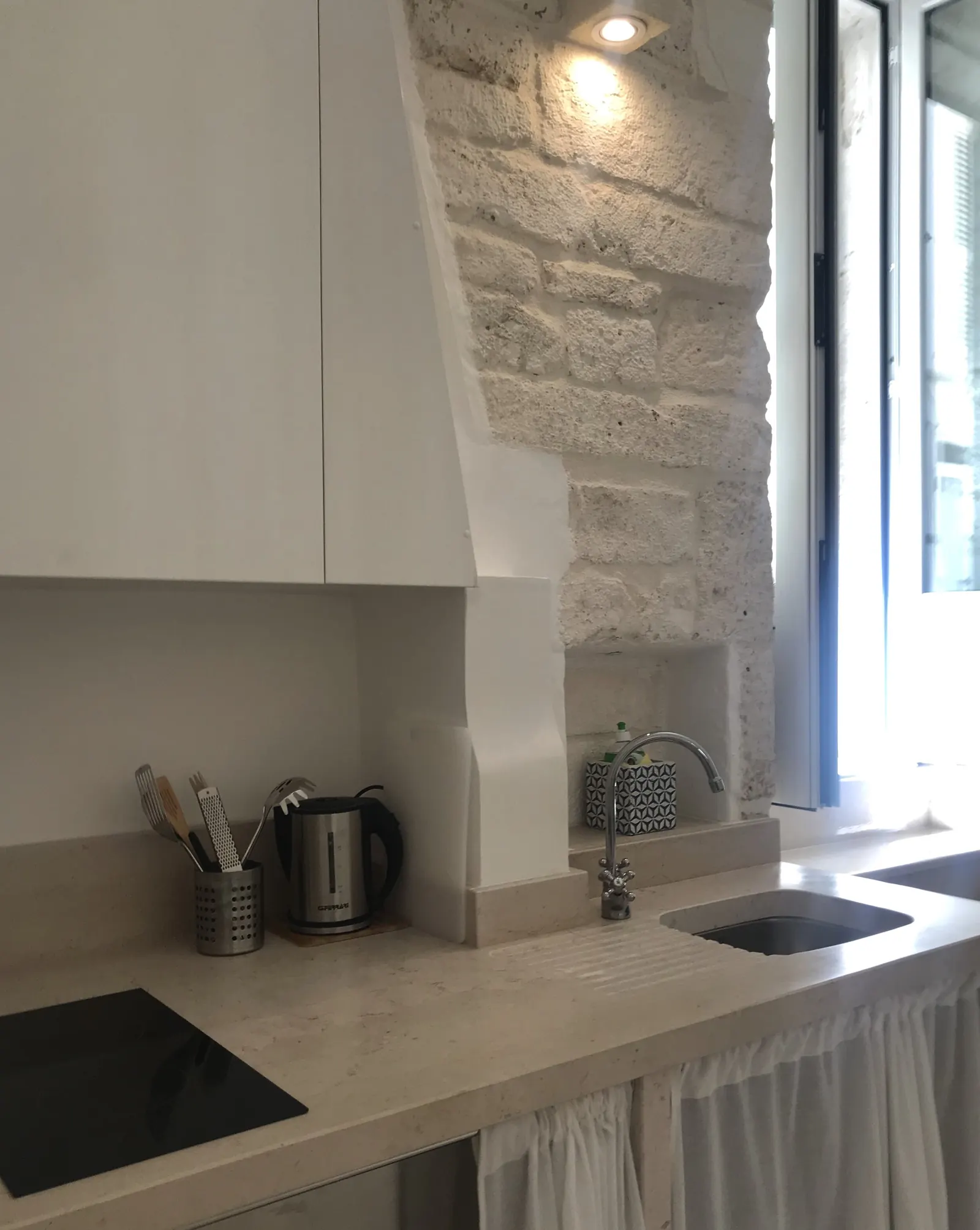 Kitchenette beneath stone walls