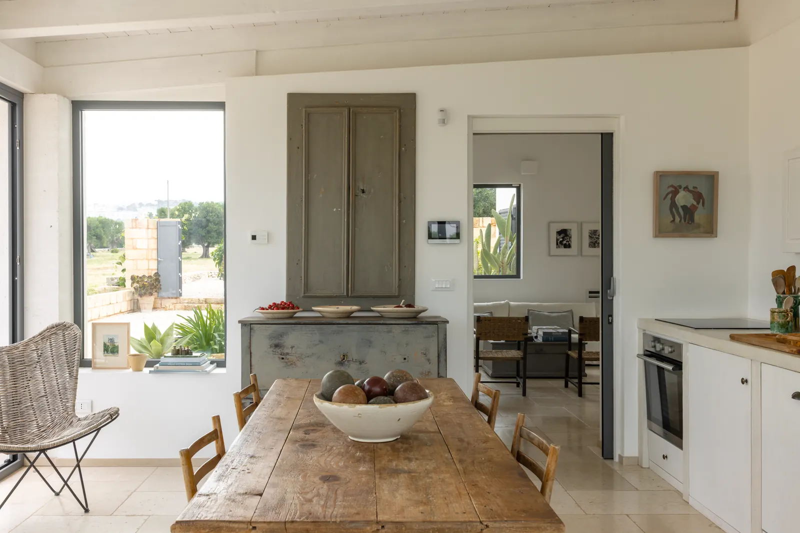 Kitchen and dining table looking through to the living room